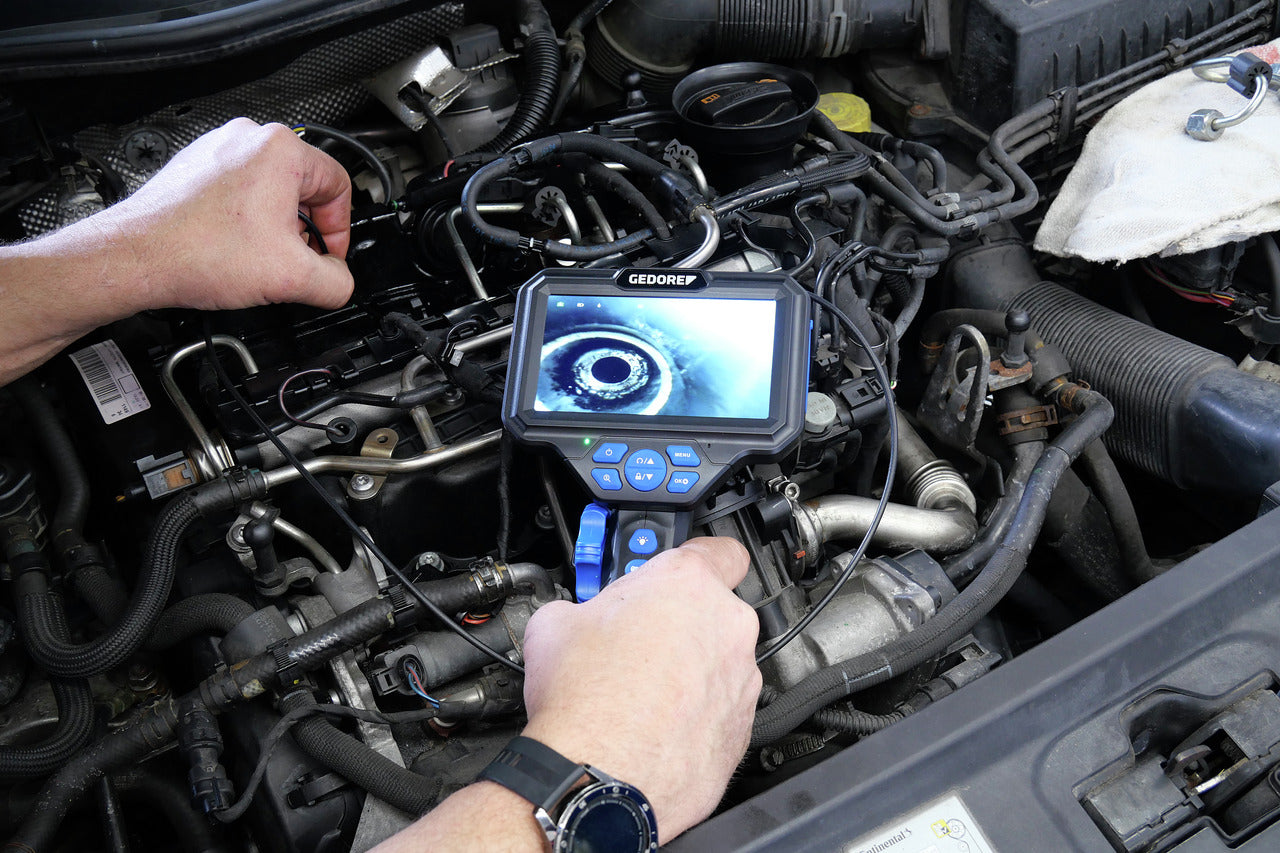the gedore micro videoscope in use by a mechanic on a vehicle's transmission